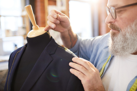Man sewing jacketの写真素材