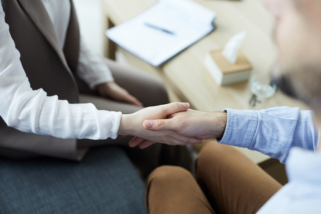 Shaking hand with counselorの写真素材