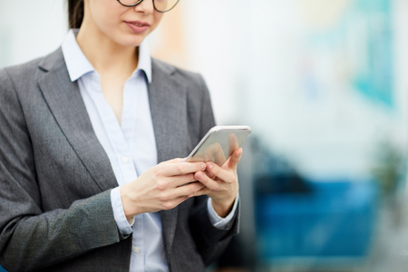 Unrecognizable Businesswoman Using Smartphoneの写真素材