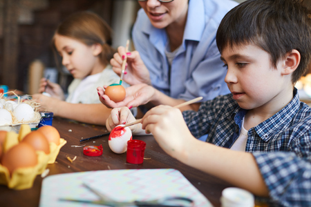 Kids Painting Easter Eggsの写真素材