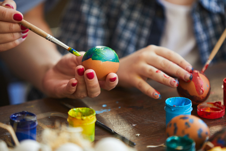 Mother and Child Painting Easter Eggsの写真素材