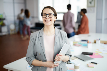 Smiling  Businesswoman Posing in Officeの写真素材