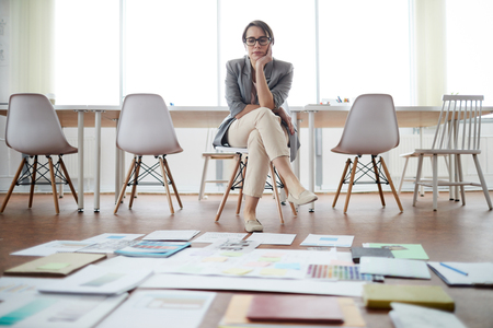 Businesswoman Planning Project in Empty Officeの写真素材