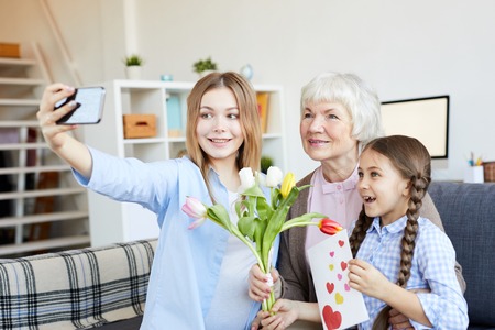Women in Family Taking Selfieの写真素材