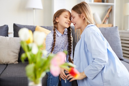 Loving Mother Cuddling Childの写真素材