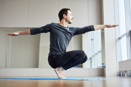 Man balancing on toesの写真素材
