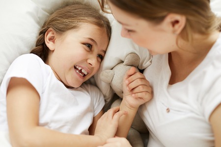 Cute Carefree Girl with Momの写真素材