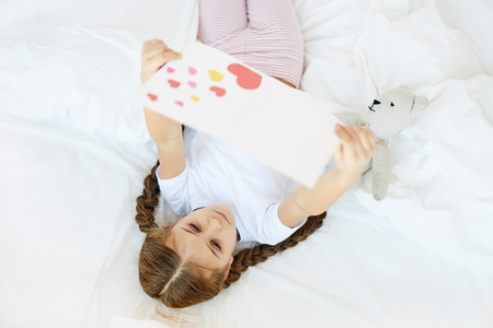 Girl Reading Handmade Cardの写真素材