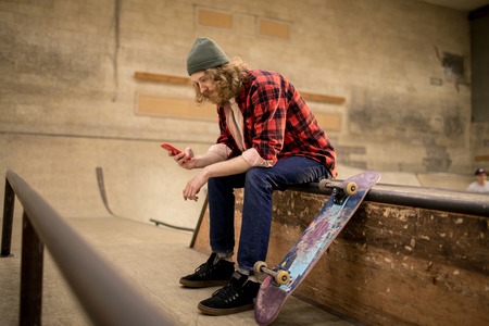 Skater Using Smartphoneの写真素材