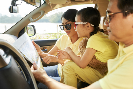 Family examining mapの写真素材