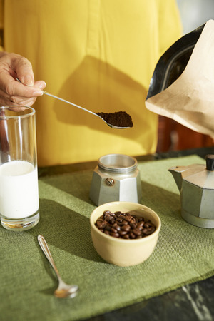 Woman making coffeeの写真素材