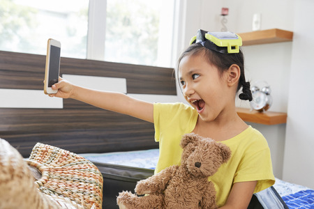 Little girl taking selfieの写真素材
