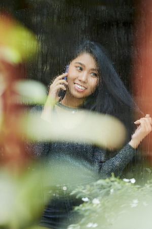 Happy woman talking on phoneの写真素材
