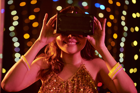 Young woman in virtual reality glasses