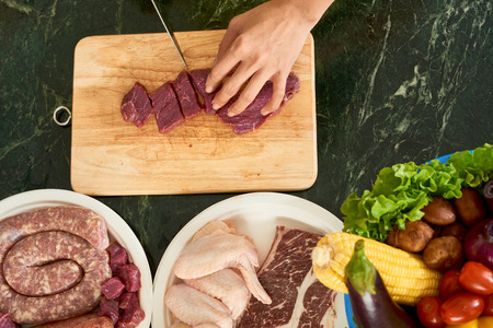 Cutting meat for barbecueの写真素材