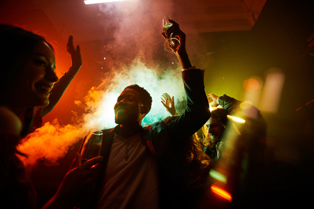 Hilarious people at noisy partyの写真素材