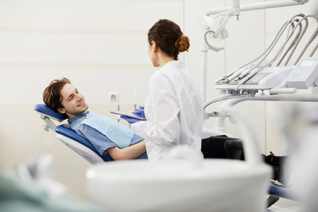 Young Man Consulting Dentistの写真素材