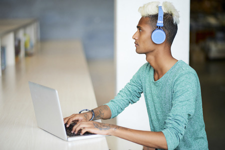 Asian student taking e-learningの写真素材