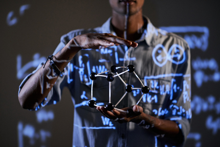 Showing geometric figure at lectureの写真素材