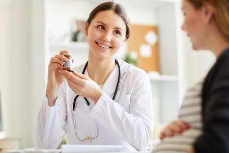 Obstetrician Giving Medicineの写真素材