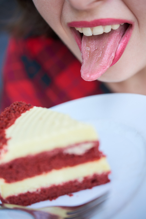 Woman licking frosting