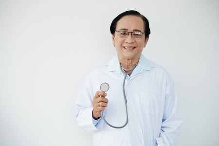 Senior doctor with stethoscopeの写真素材