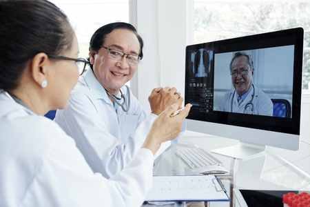Medical workers having video conferenceの写真素材