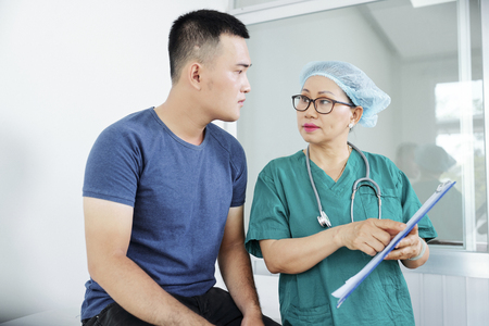 Nurse talking to patientの写真素材
