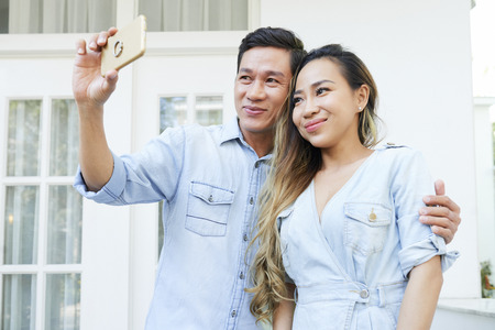 Beautiful female Asian couple posing for selfieの写真素材