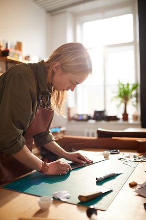 Female Artisan in Sunlit Shop