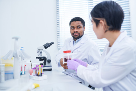Laboratory workers investigating samples