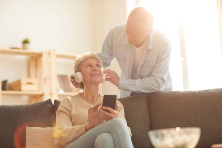 Senior Couple Using Devices