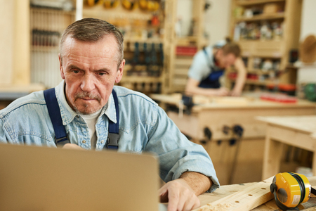 Senior Worker Using Laptopの写真素材