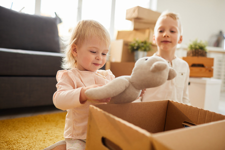 Cute girl has found favorite toy in boxの写真素材