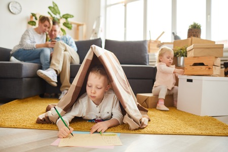 Boy drawing new house for his familyの写真素材