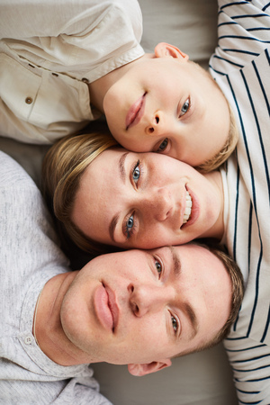Happy beautiful family posing for cameraの写真素材