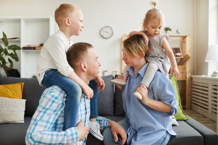 Parents playing with children