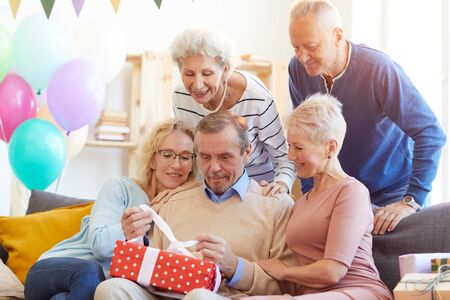 Opening birthday presents among friends