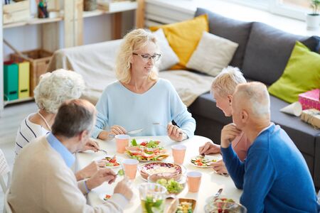 Happy woman enjoying dinner with friendsの写真素材