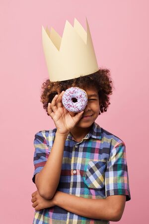 Boy Holding Donutの写真素材