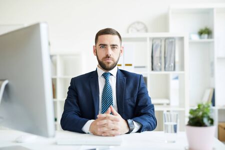 Serious business executive in office