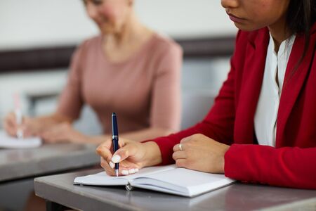 Businesswoman Writing in Plannerの写真素材
