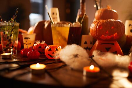 Halloween background of witches table with candles and pumpkins decorations set for party in nightclub, copy spaceの写真素材
