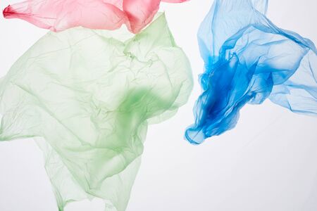 Close up image of recyclable plastic bags isolated on white background, waste sorting and management...