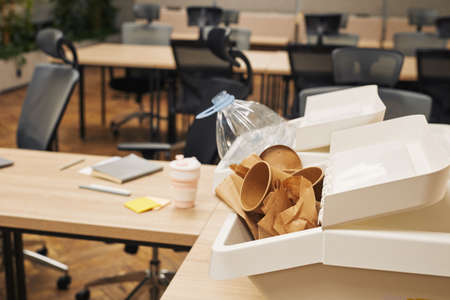Background image of two waste sorting containers on desk in modern office interior, copy spaceの写真素材