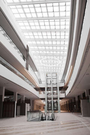 Vertical background image of empty shopping mall or office building under construction, copy spaceの写真素材