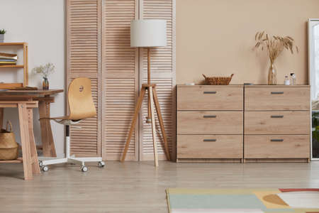 Warm toned background image of minimal home interior with wooden elements and natural decor, copy spaceの写真素材