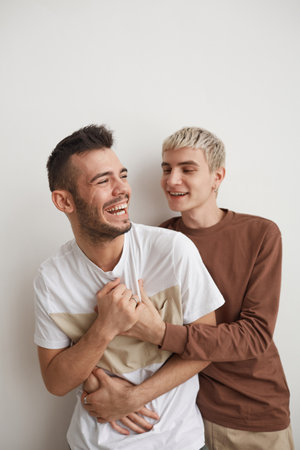 Carefree Gay Couple on White