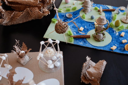 Top view background image of handcrafted school projects on table for biology class, copy space