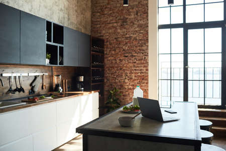 Background image of empty kitchen interior with loft design elements, copy spaceの写真素材
